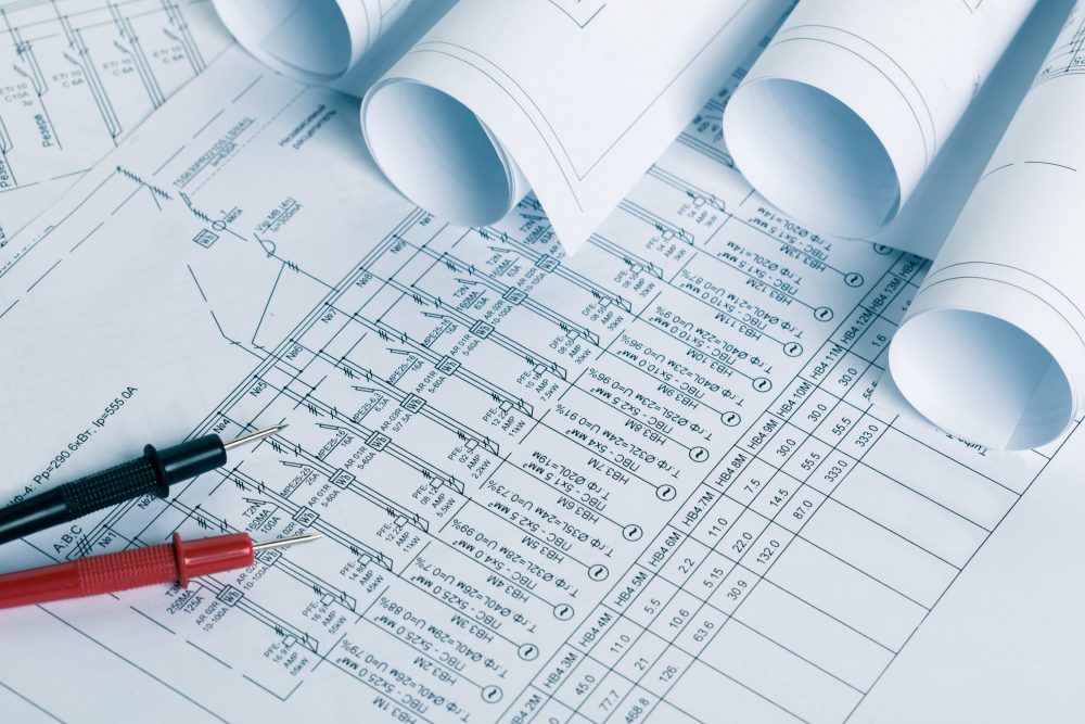 A close up image of technical drawings for an electrical consultancy.