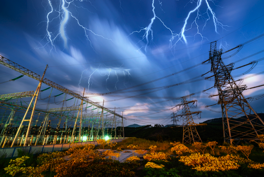 Lightning Protection - Lightning striking over a substation at night.