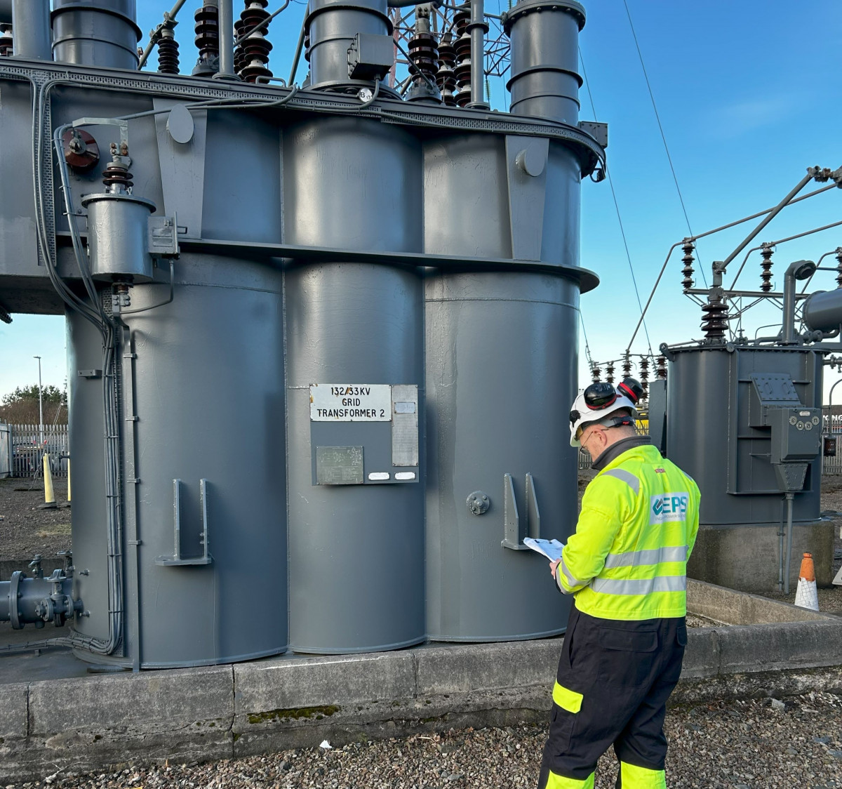 An EPS electrical engineering graduate on site during a survey.